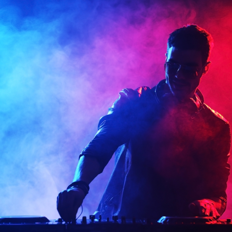 A DJ performing EDM music live.